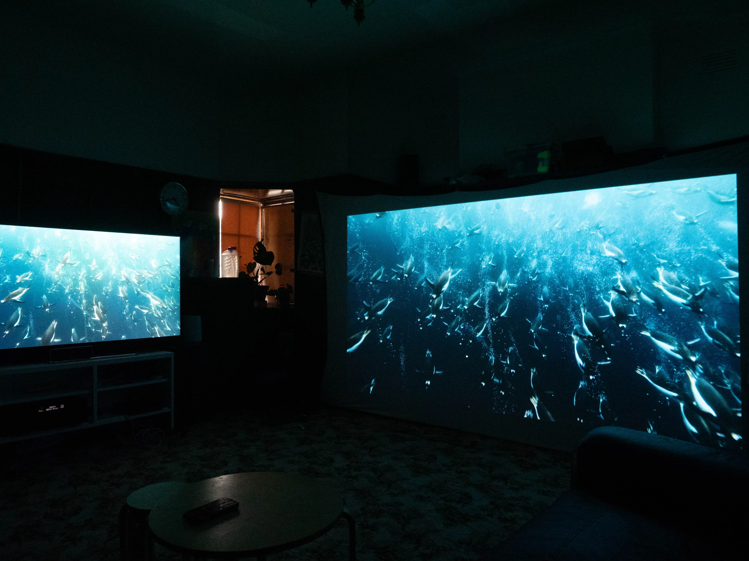 Lights-out comparison against a 75-inch QLED TV