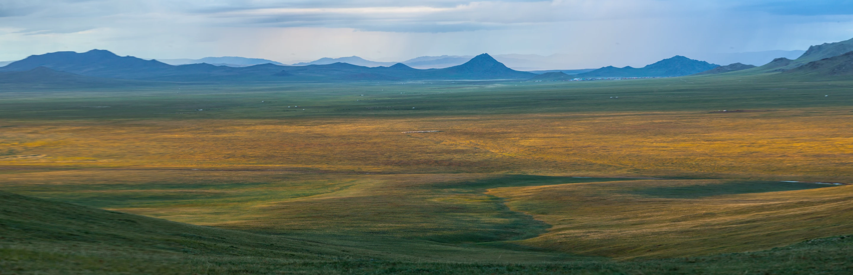One of the most spectacular campsites on the trip sat in a saddle overlooking this magnificent valley. The town in the distance is some 20 or 30km away, and if you look closely you can see gers and herds of animals dotted throughout the plain. Near Tudevtey
