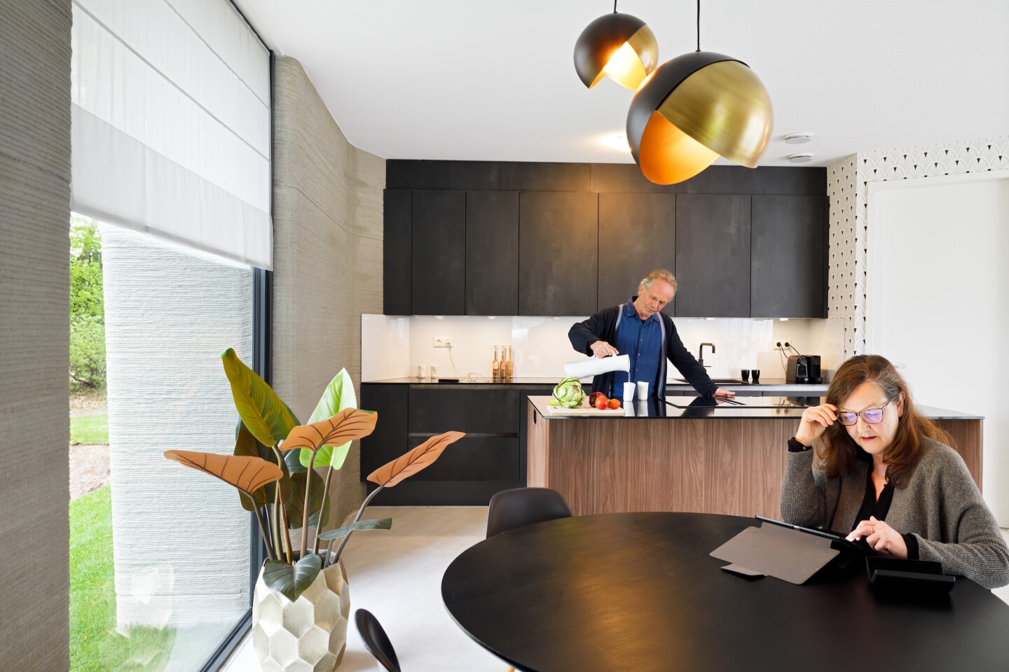 The 3D-printed house looks clean and light-filled thanks to generous glazing