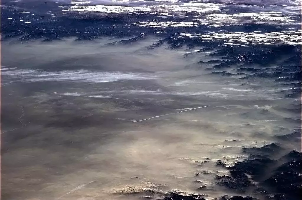 Hadfield: "A springtime haze laps on the evening shore of the Alps" (Photo: Chris Hadfield/NASA)