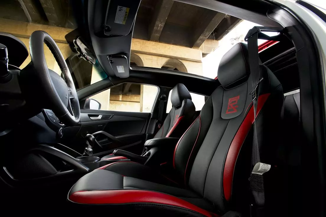 The red and black interior matches some of the exterior color scheme