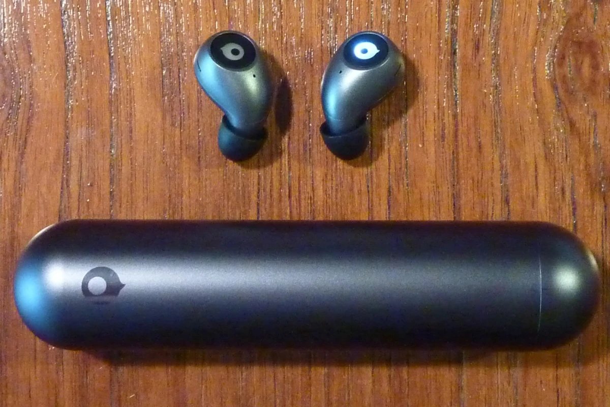 The Crazybaby 1S earbuds and portable charging capsule