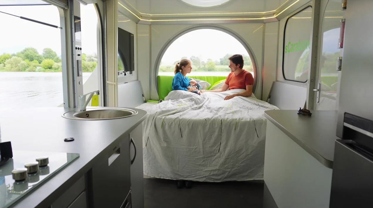 The sCarabane dining set transforms into an extra bed, and the large bubble window helps occupants manage natural light