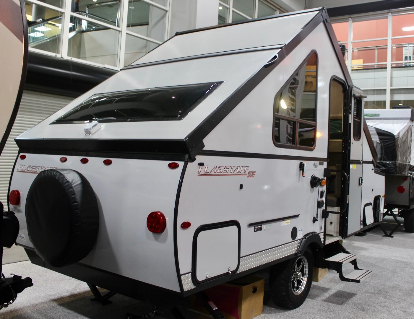 This pop-up A-frame-style camper from Flagstaff (another Forest River brand) combines the low-riding advantages of a pop-up tent trailer with the hard-sided advantages of a taller small trailer