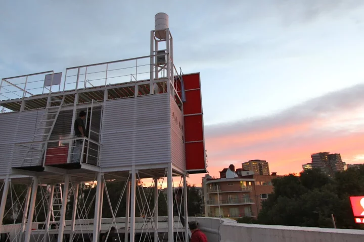 The Billboard House is a simple home built onto the back of a billboard in Mexico City to temporarily house an artist while she works on a new hand-painted advertisement