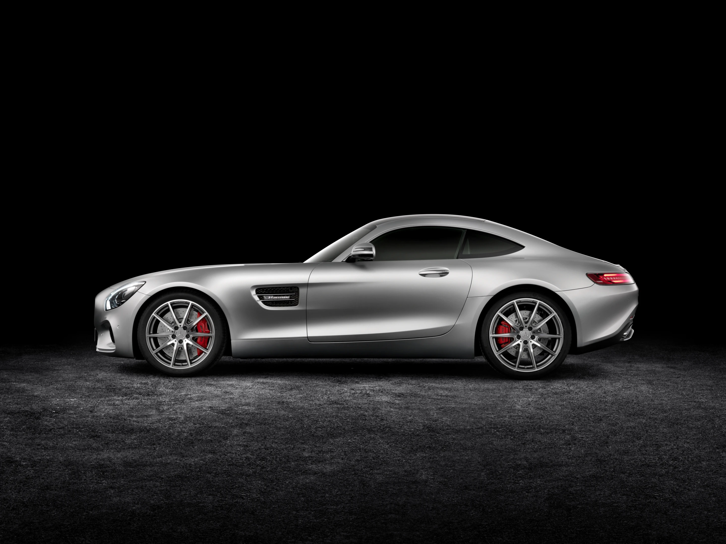 The car's frameless doors give it a classic coupe silhouette