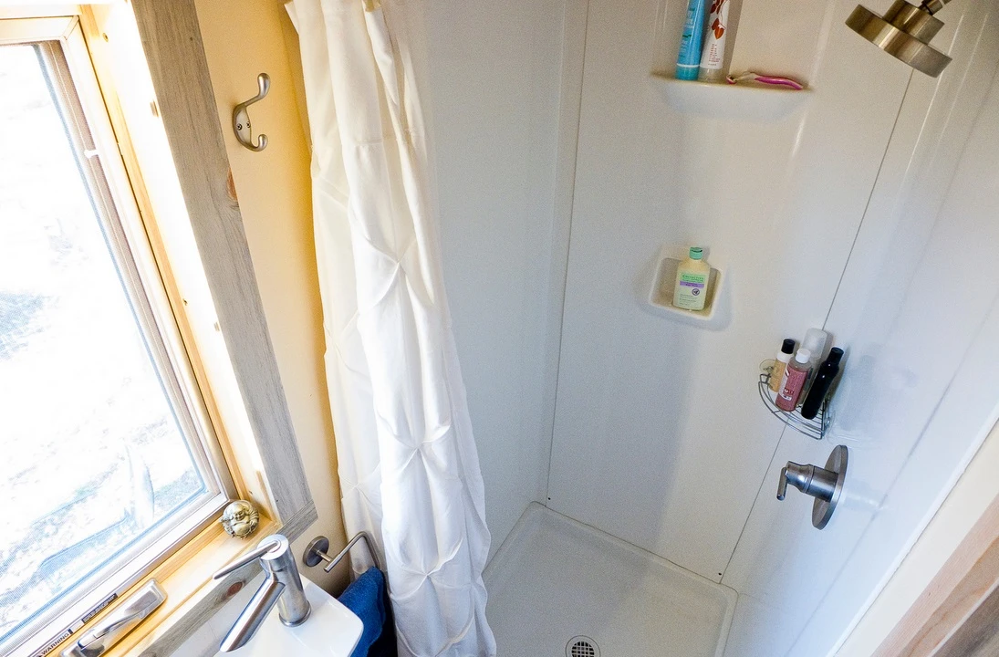 The bathroom's small but functional shower cubicle