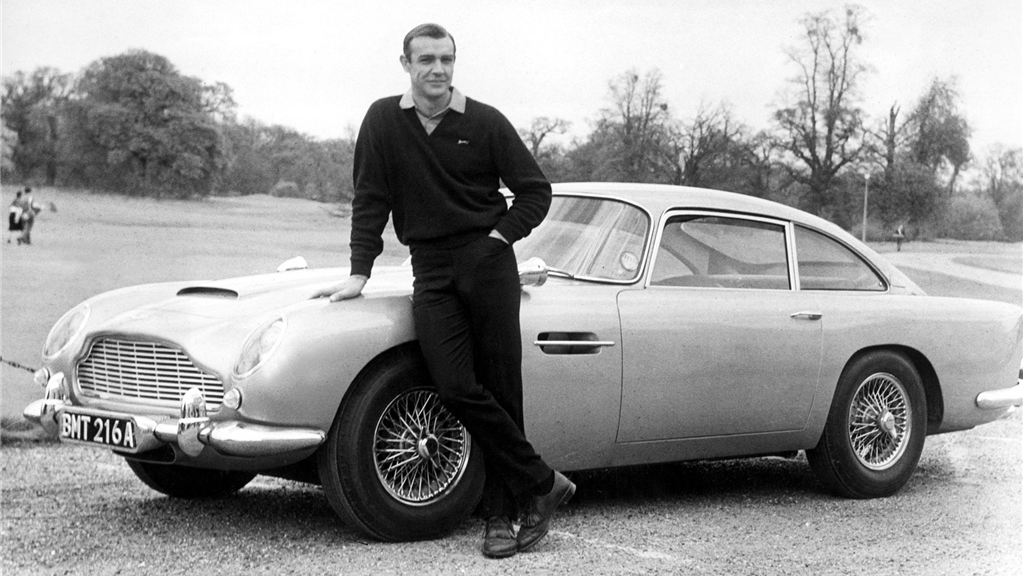 A publicity shot of James Bond (Sean Connery) and the Aston Martin DB5 which starred alongside him in the films Goldfinger and Thunderball. The car was sold by RM Auctions for US$4,620,000 in 2010.