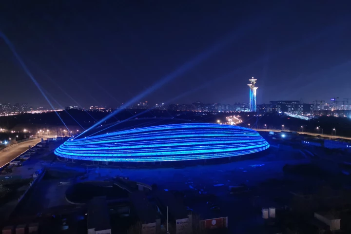 The Ice Ribbon is defined by an eye-catching facade wrapped in 22 "ribbons" of lighting which can be individually illuminated