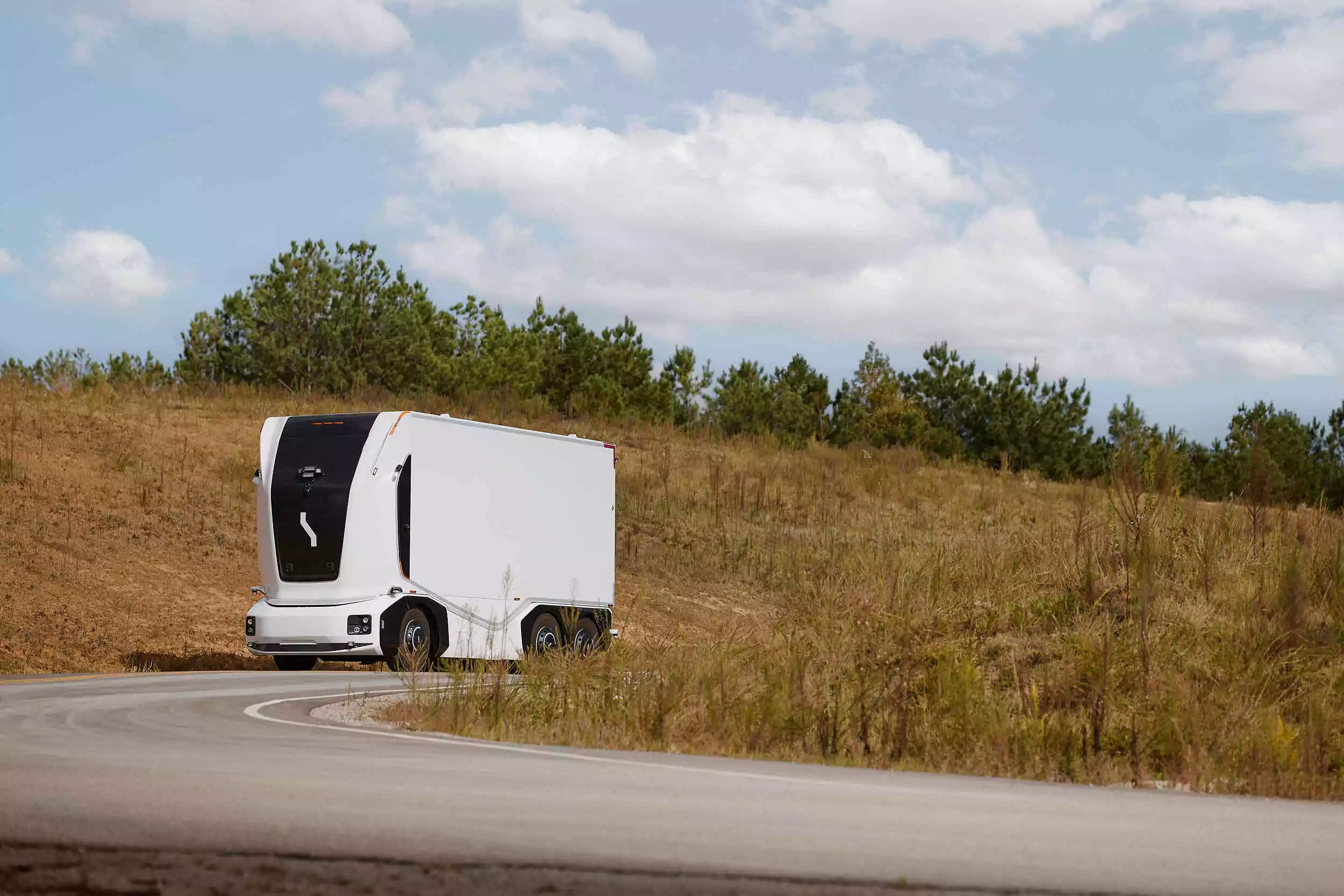The cabless autonomous electric truck is remotely monitored by a human operator