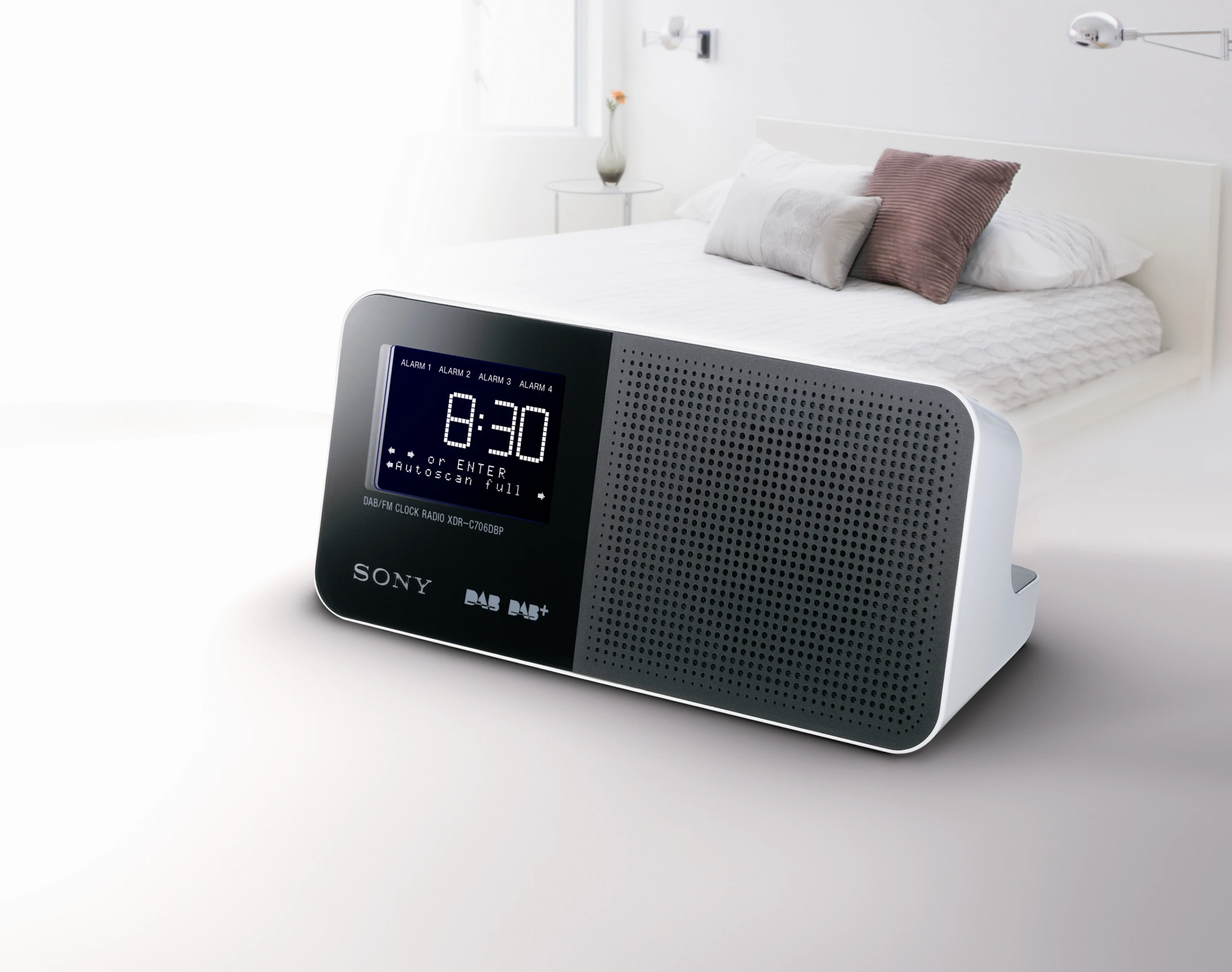 A two line station/program information box is positioned below the clock display of the XDR-C706DBP clock radio