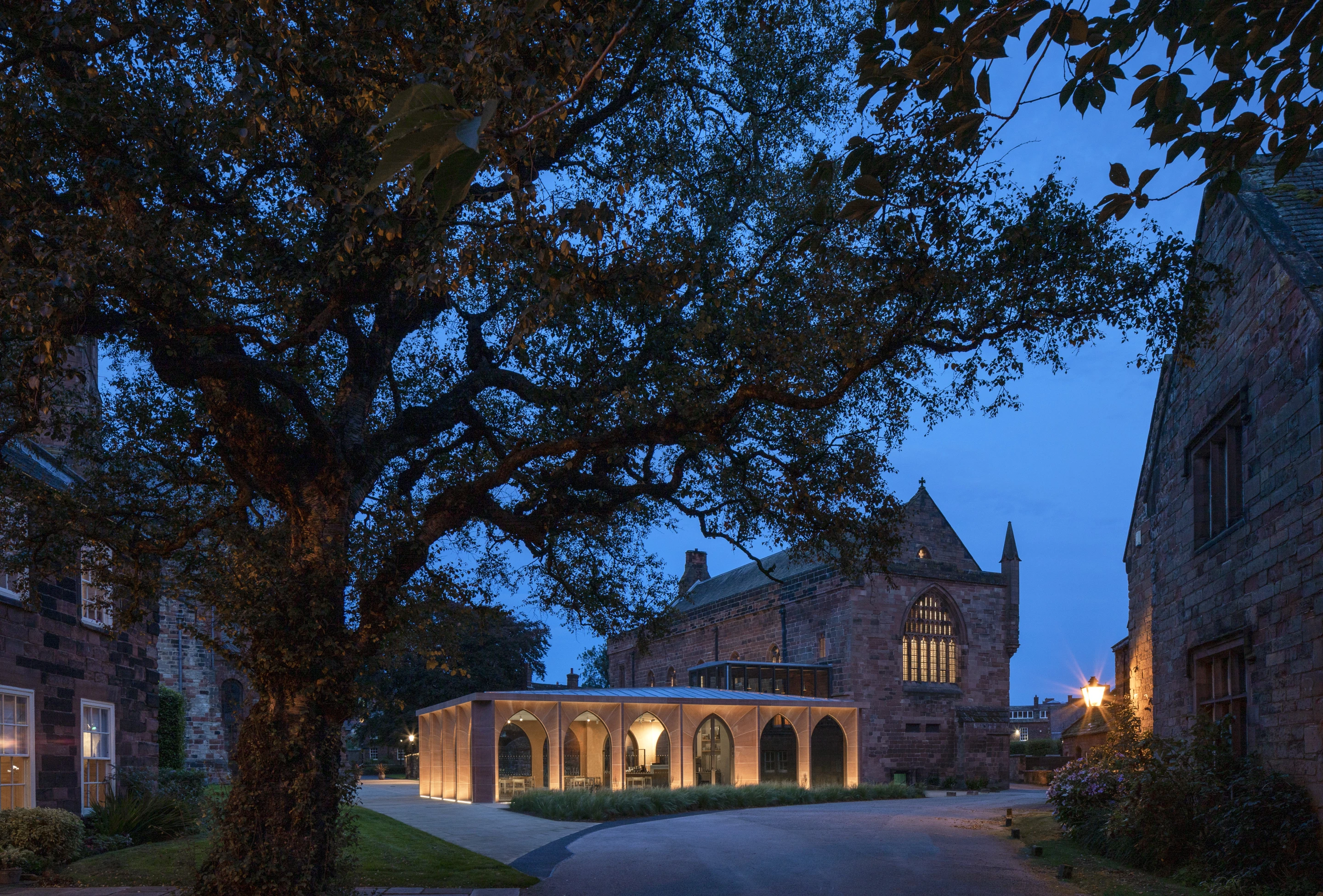 The Fratry was designed by Feilden Fowles and is located in Carlisle. The project involved renovating a cathedral on the site and added a tasteful timber cafe