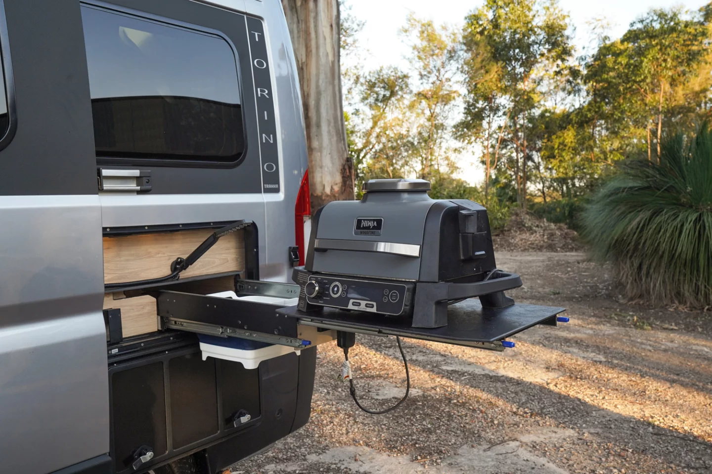 Trakka replaces the simple slide-out worktop on older models with a worktop/sink slide complete with hot/cold tap – perfect for use with the optional Ninja electric wood pellet grill