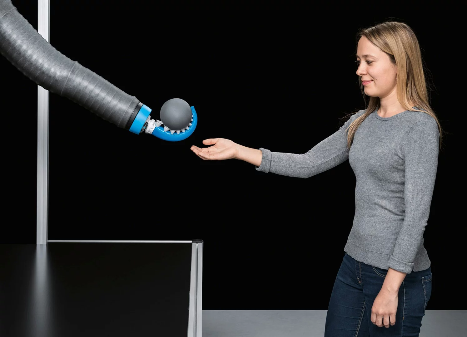 The OctopusGripper's soft silicone structure has a chamber running along its length that causes the tentacle to bend inwards when compressed air is applied, wrapping itself around objects of varying shapes