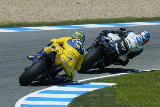 Makota Tamada and Troy Bayliss had a battle that lastest almost the entire race before the Baylisstic Troy got the better of the fight