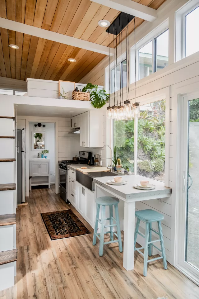 The Ohana tiny house's kitchen includes a small breakfast bar