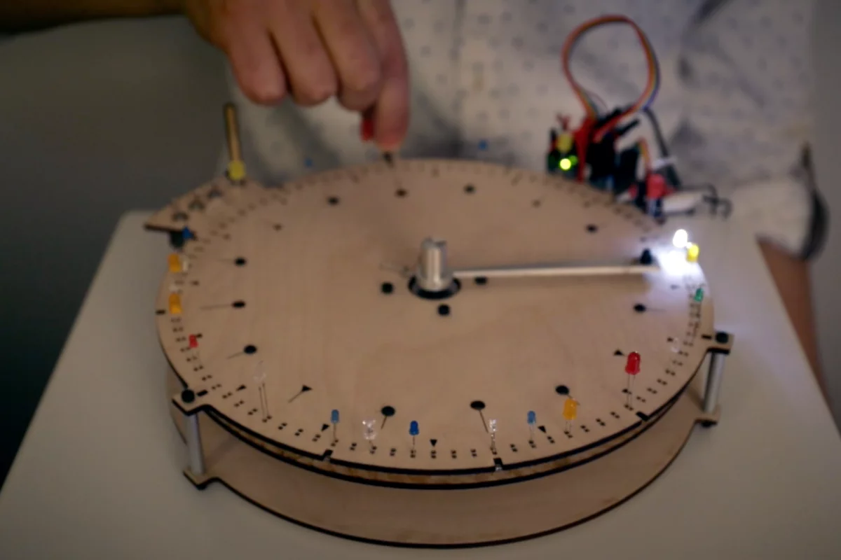 The sequence is set by popping in LEDs around the BlinkWheel's edge, and triggered when a rotating arm comes into contact with an LED's anode