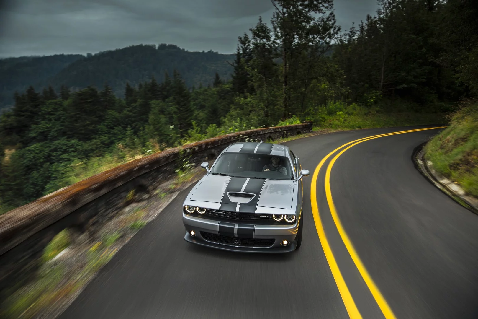 For the Challenger Hellcat model, SRT added a lot of air movement goodies to the car, including the immediately-noticeable extra air intakes on the hood flanked by vents to push it back out