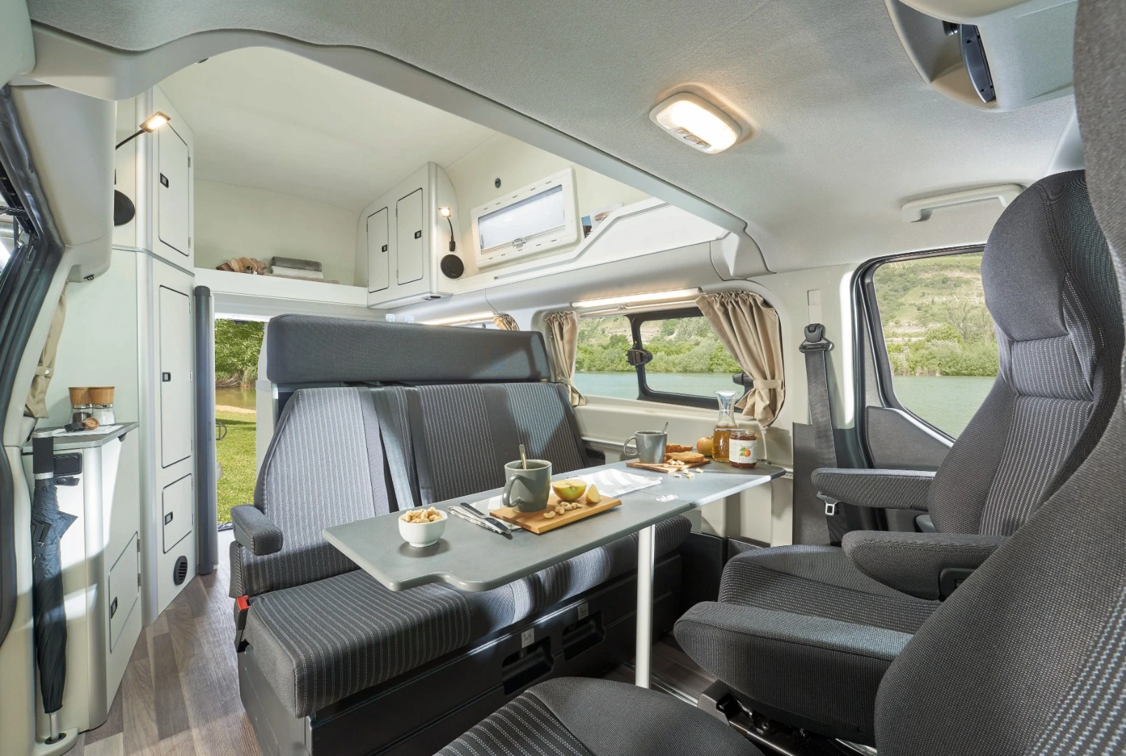 The three-seat bench and swivel cab seats provide space for five around the table