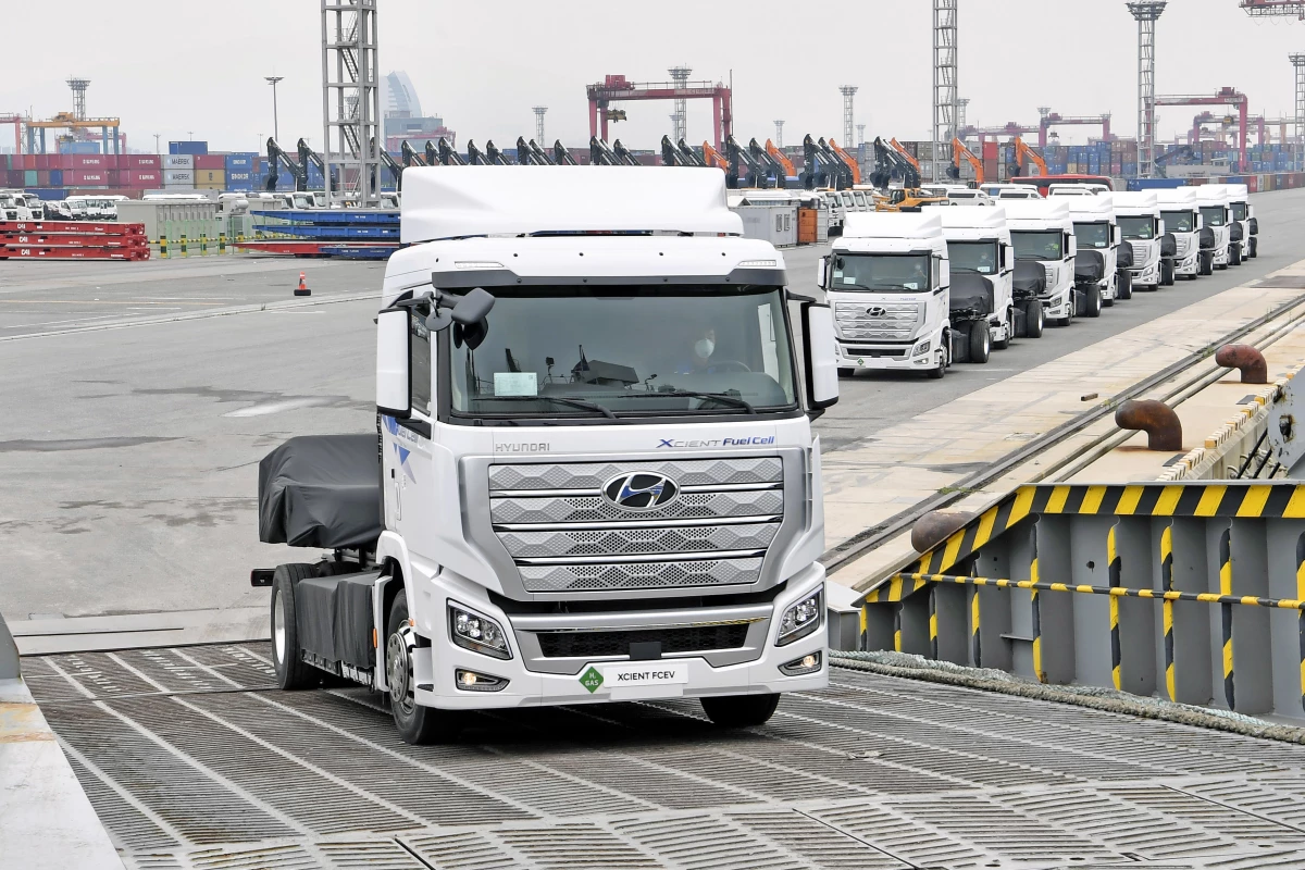 The first 10 hydrogen powered Xcient Fuel Cell trucks board a ship in Korea headed for Switzerland