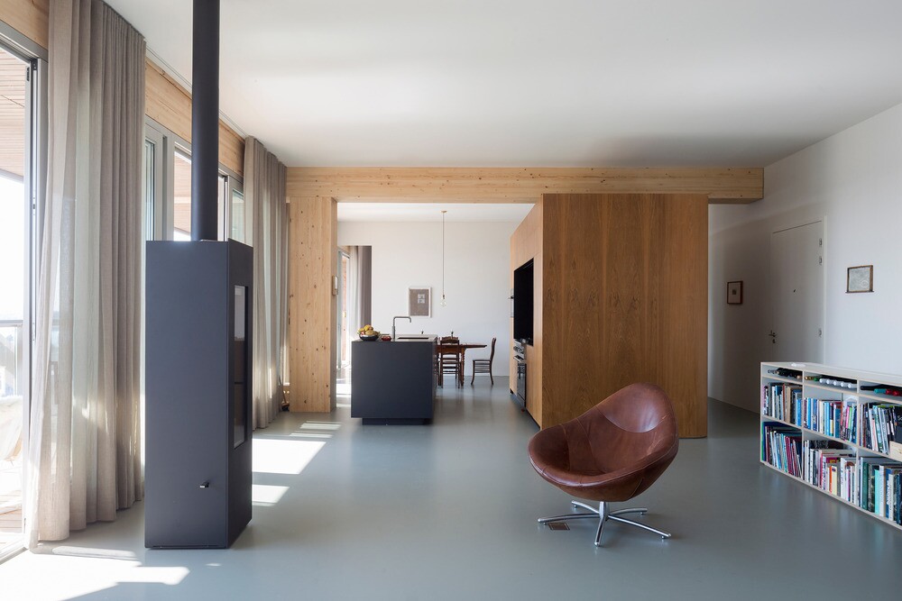 Heating is provided by a furnace in the basement that's piped to underfloor heating and runs from pellets derived from timber waste, though there are also stoves inside some of Patch22's apartments