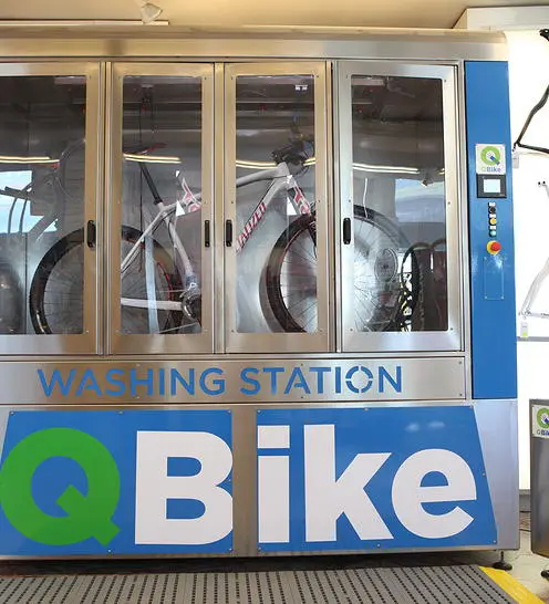 Users start by hanging their bike from its handlebar and saddle, on provided hooks and loops inside the washing station