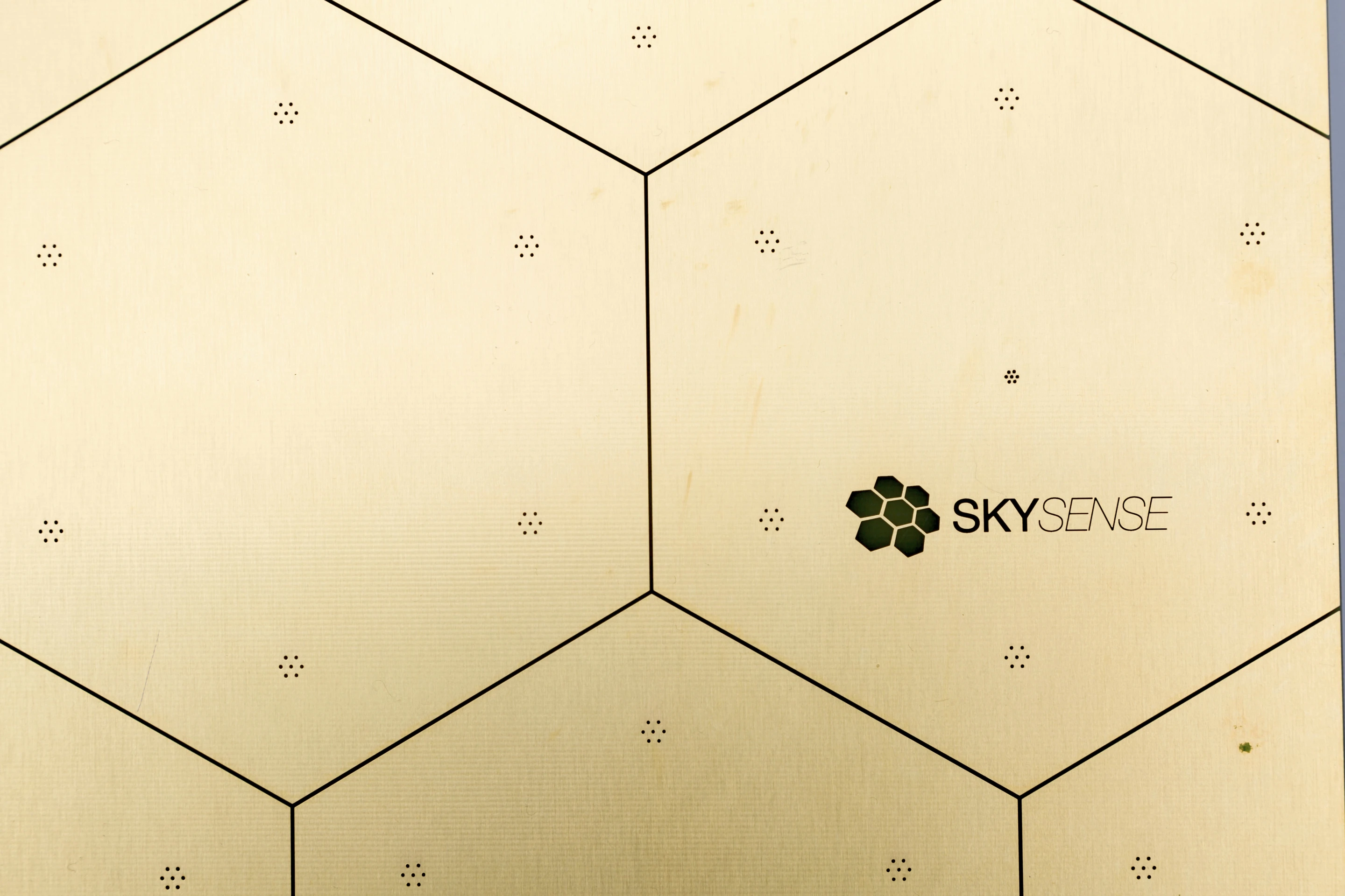 The SkySense Charging Pad is a gold-plated dock with a 100- 240 V power input and a 10 A charge rate