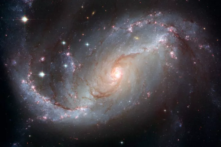 ASA will help shed light on cosmogenic neutrinos, which are produced by energetic objects, such as this active galaxy NGC 1672