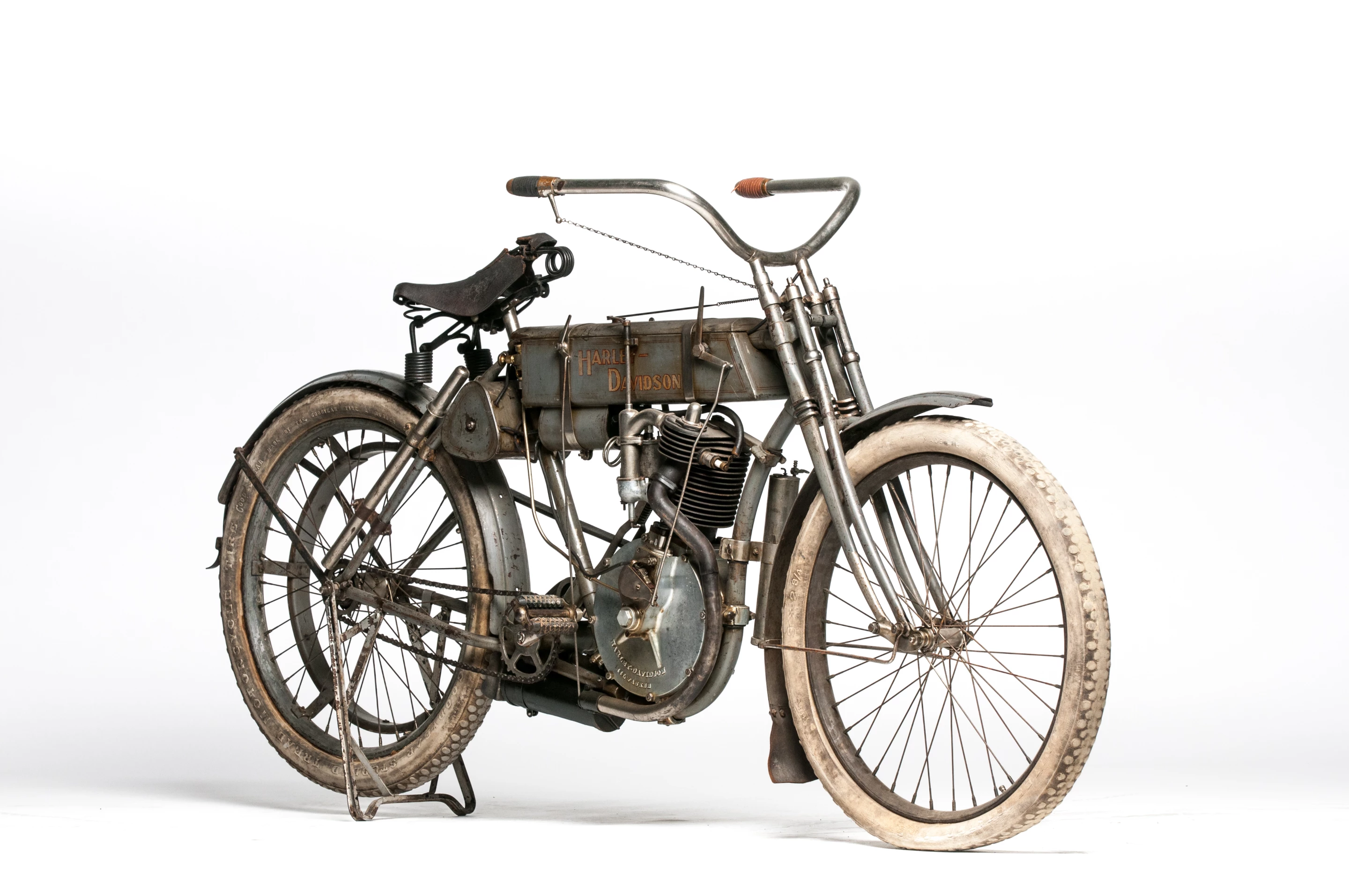 The highest estimated price of all the bikes in the Cole Collection has been placed on this 1907 Harley-Davidson Strap Tank. This bike is one of the first 100 Harley-Davidsons ever built. Its serial number suggests it was the 37th bike made in 1907, making it the 94th bike overall, including the original two prototypes. Strap tank single Harleys are rare, but the striking aspect of this bike is its originality.