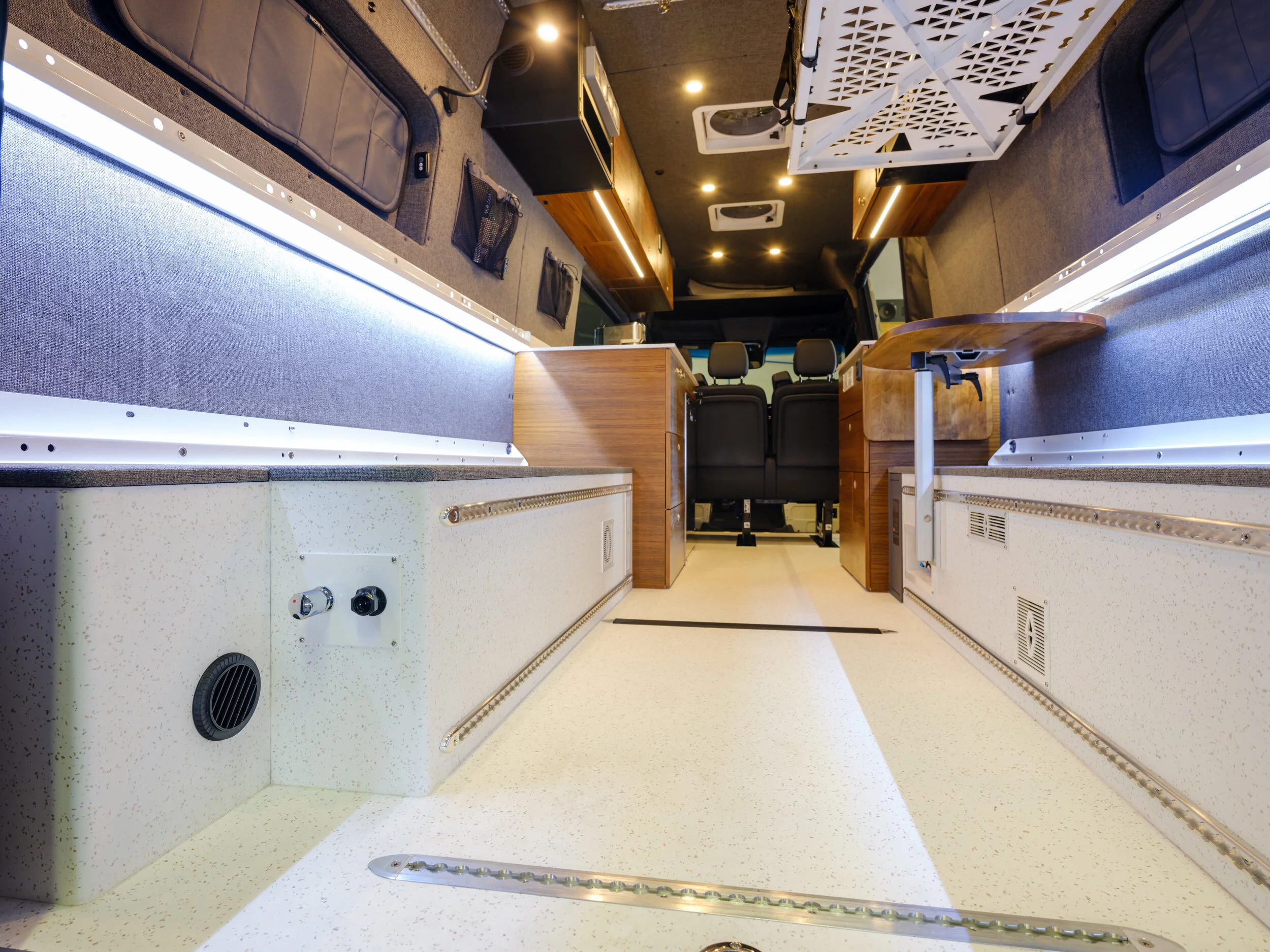 Rails on the floors, benches and sidewalls help in creating a highly flexible camper interior