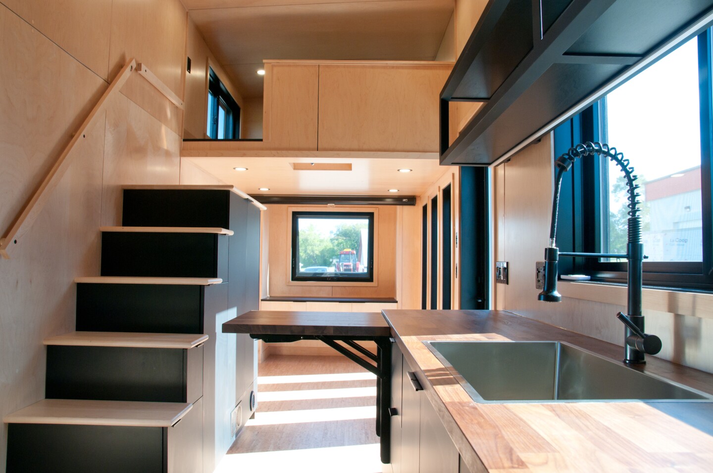 The Orme's bedroom is located above the living room and is accessed by storage-integrated staircase