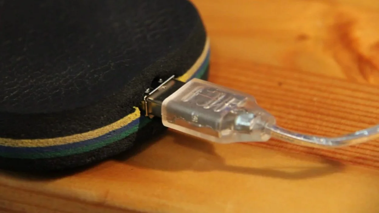 The inventor placed a USB port at the heel of each beach sandal