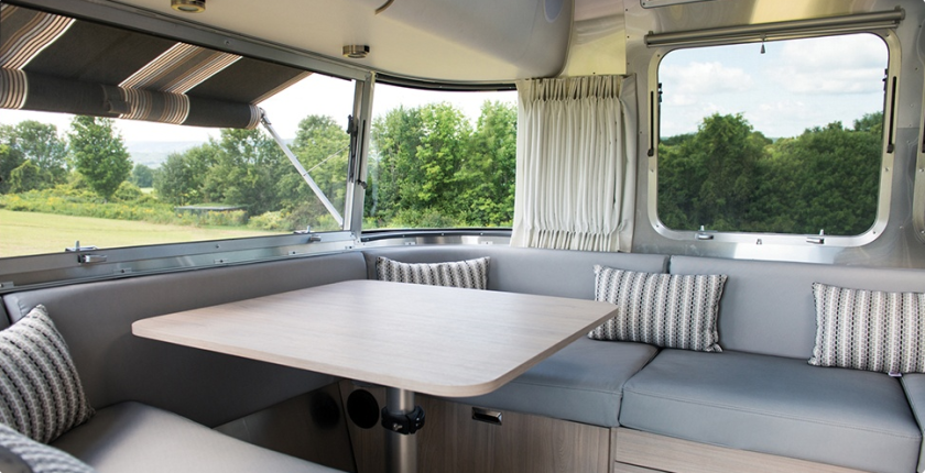 The Airstream Globetrotter's lounges pull out for extra bedding and are covered in finely woven, stain resistant fabric