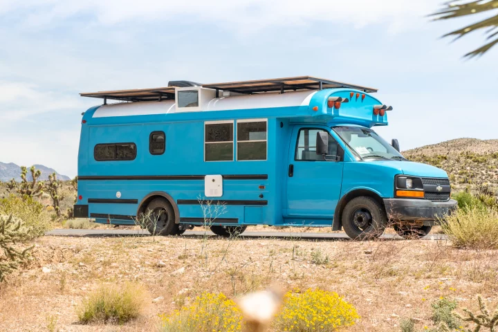 Mybushotel's first B-Hotel, Leon is a bright-blue Chevy Express skoolie