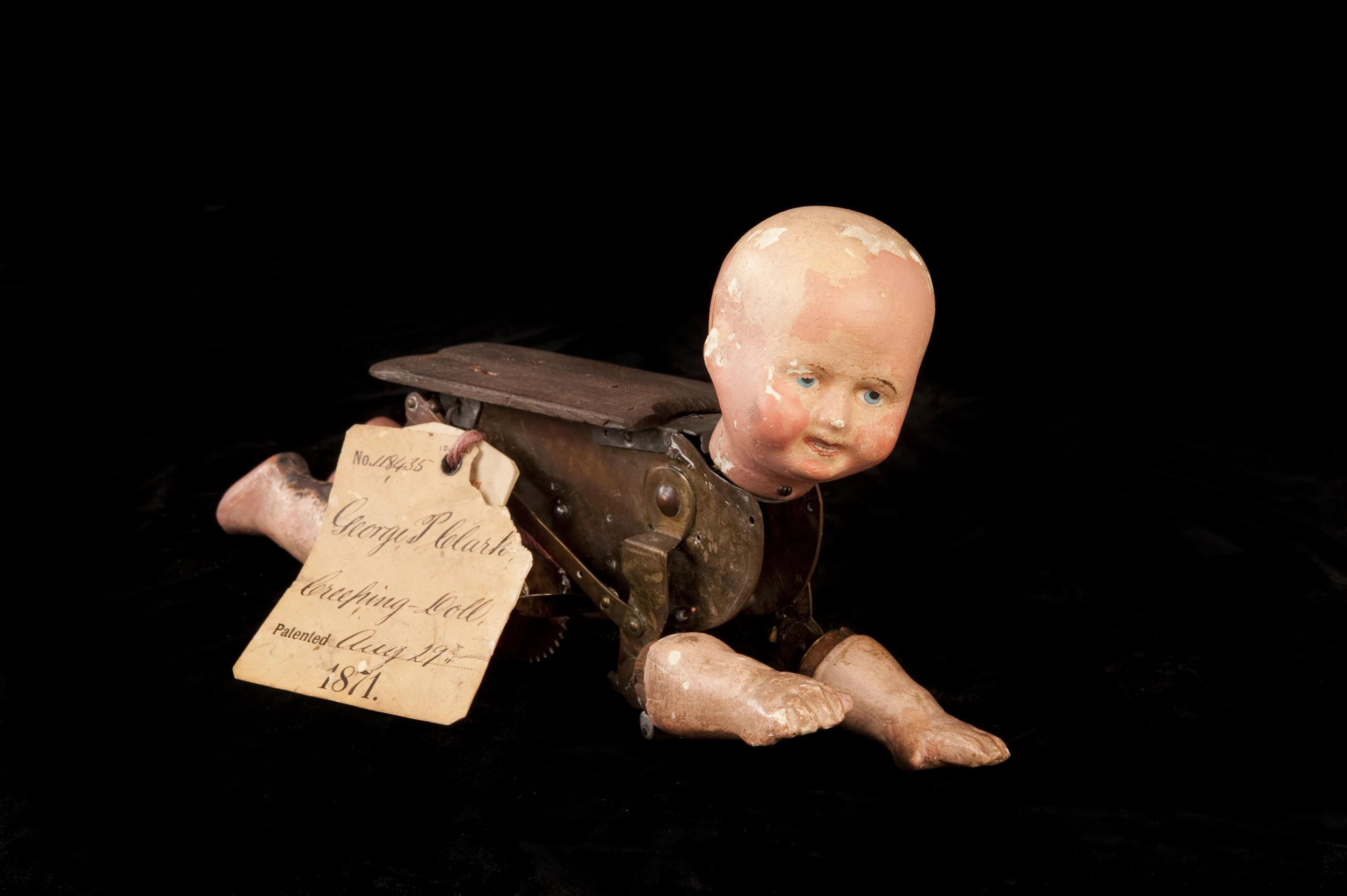A patent model for the "Natural Creeping Baby Doll," patent granted to George Pemberton Clarke in 1871