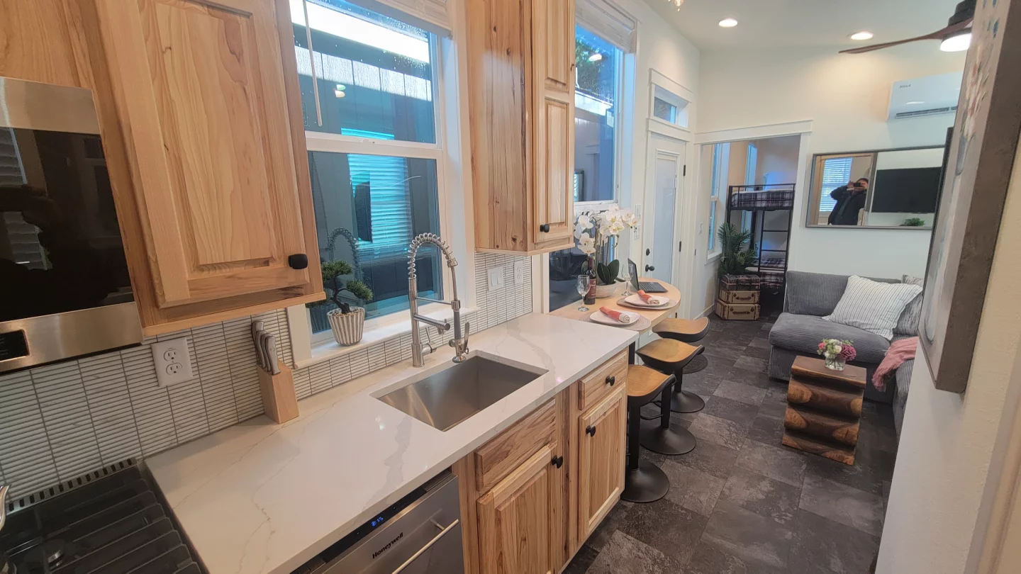The Olivia Summit's kitchen has quartz countertops and hickory cabinetry