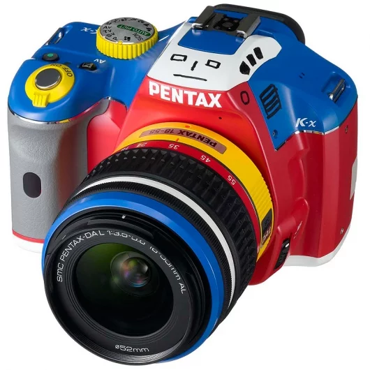 The lens and the camera body are styled just like the Korejanai Robo toy, with the pop-up flash being the robot's head