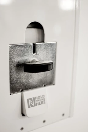 Deliciously retro-looking coin slot lever to the front of the Digital Gum Machine waiting for a 50 cent coin