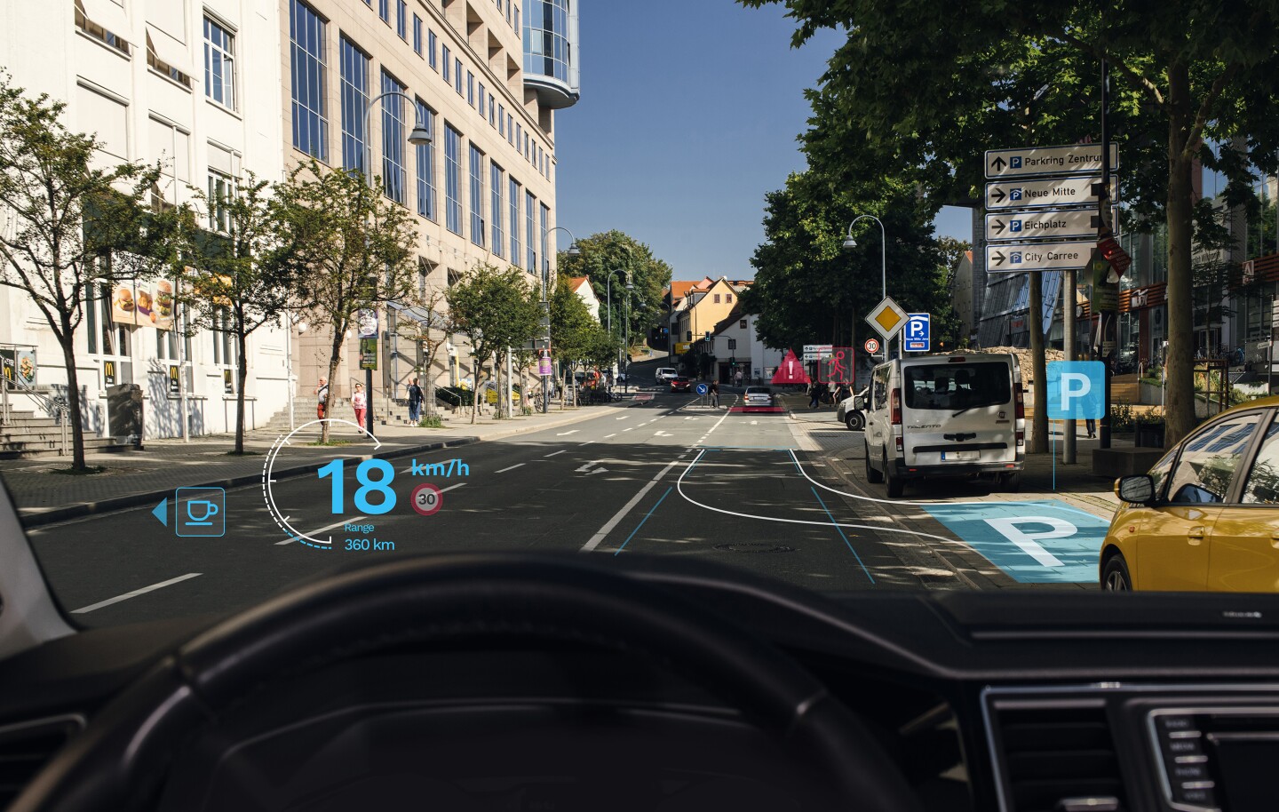 హెడ్స్-అప్ డిస్‌ప్లేగా పని చేయడానికి వాహనం యొక్క విండ్‌షీల్డ్‌కు మైక్రో-ఆప్టికల్ లేయర్ వర్తించబడుతుంది.