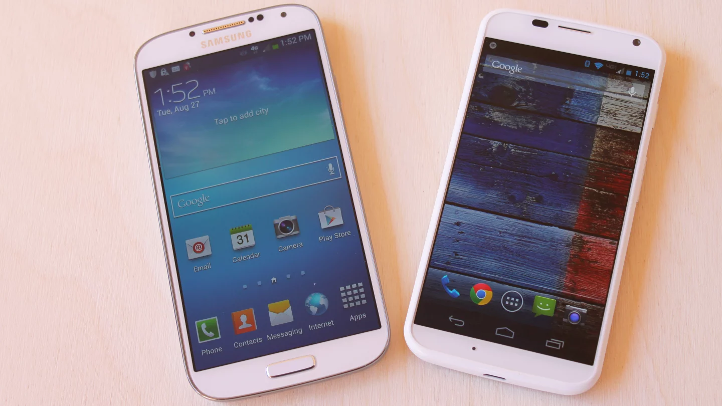 The Galaxy S4 runs Samsung's TouchWiz on top of Android 4.2, while the Moto X runs a very slight variation on stock Android