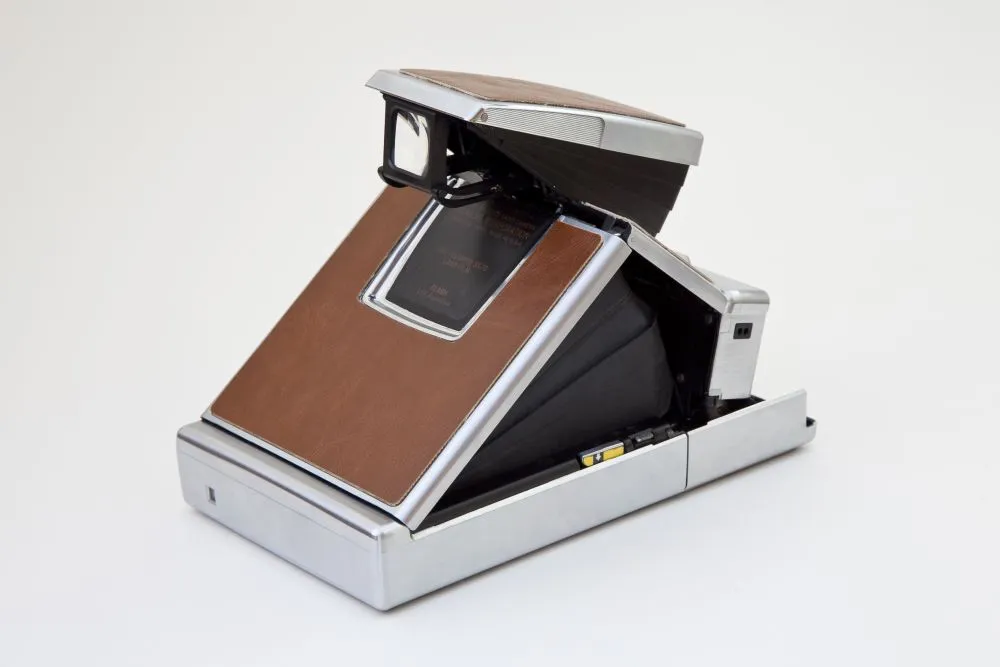 Polaroid SX-70 introduced a foldable SLR design and color instant photography, and was the first instant SLR in history