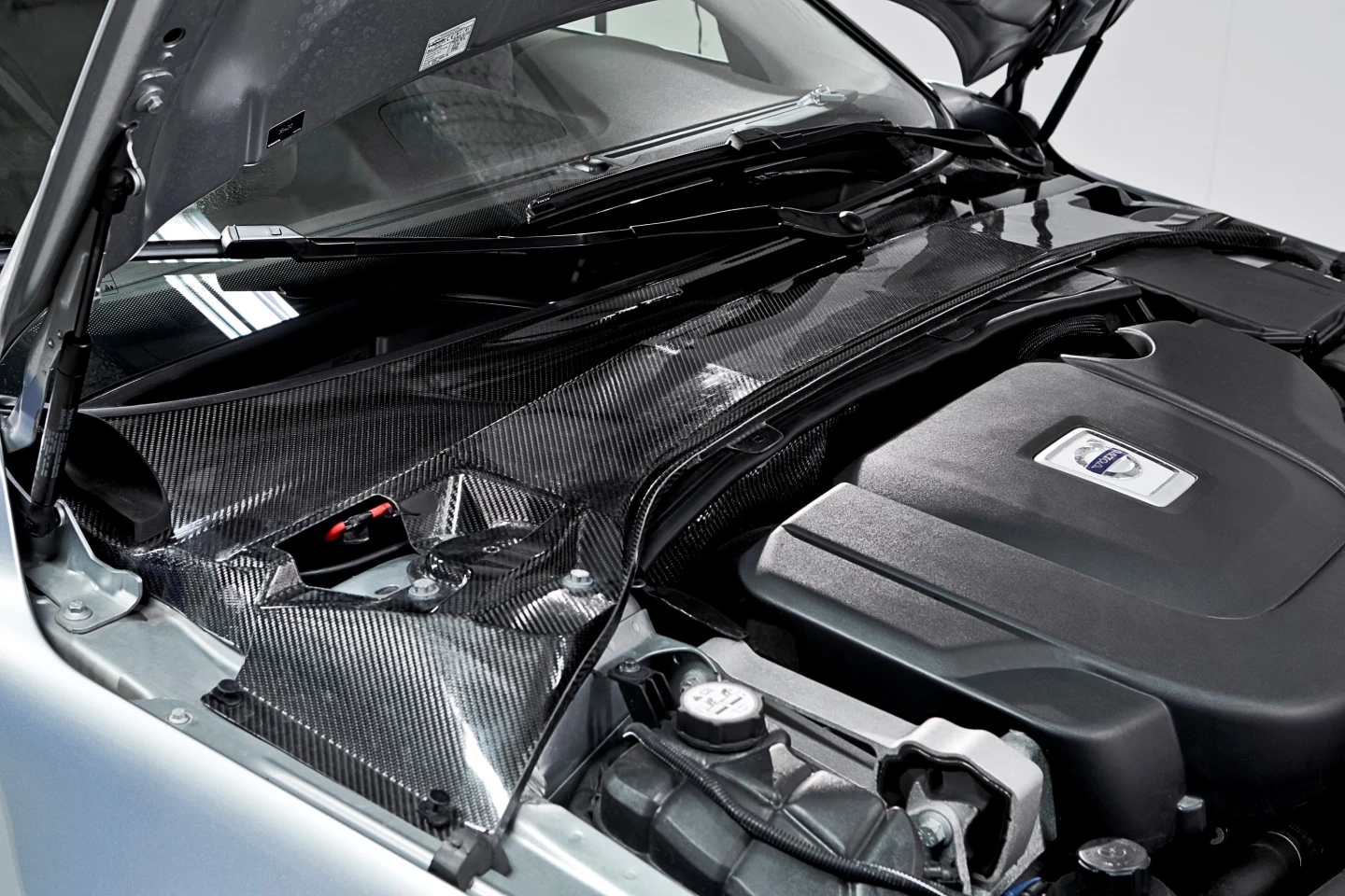 Capacitor infused carbon fiber crossmember in place on Volvo S80 test vehicle
