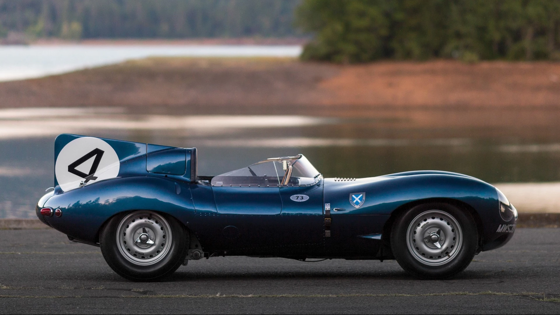 This 1955 Jaguar D-Type (chassis no. XKD 501) was the first D-Type supplied by Jaguar to a non-factory team, the famous Scottish Racing team, Ecurie Ecosse, which used it to win the 1956 24 Hours of Le Mans with drivers Ron Flockhart and Ninian Sanderson. The car spent the previous two decades in one of America's leading automotive collections prior to its sale by RM-Sothebys at Monterey, 2016 where it sold for $21,780,000 to become the most valuable British car ever to sell at auction.