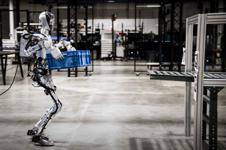 The Figure 01 humanoid autonomously moves boxes around a warehouse, in a preview of the work it'll be doing at BMW