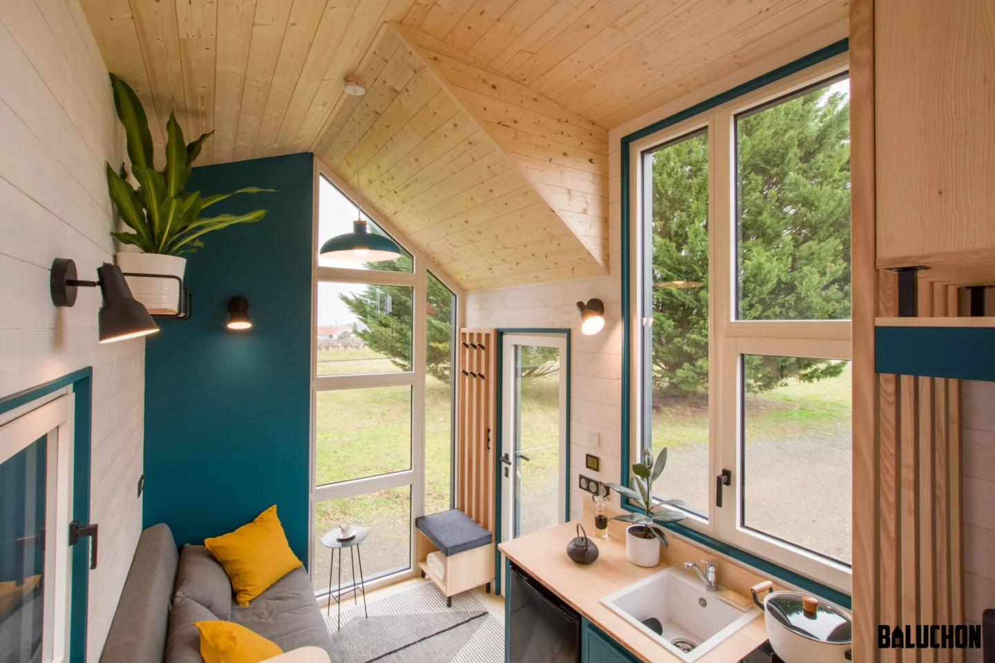 The Sherpa's living room looks light-filled thanks to its generous glazing and high ceiling
