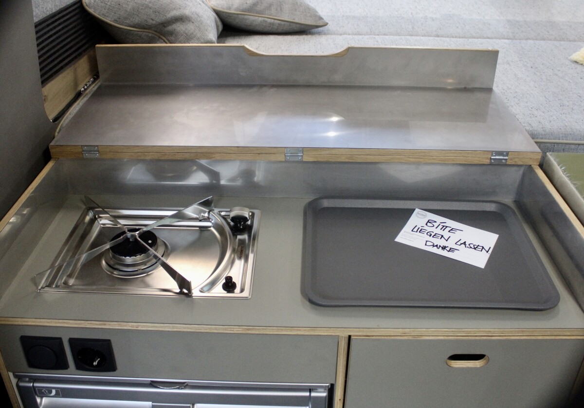 The show model has a single-burner stove, but Rocket Camper also mentions a dual-burner option
