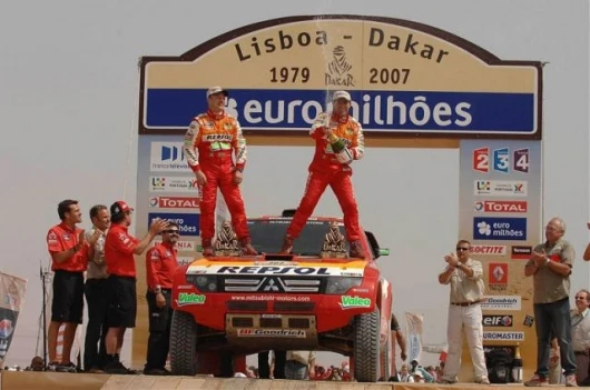 Stephane Peterhansel and Jean-Paul Cottret celebrate their victory in the 2007 Dakar Rally.