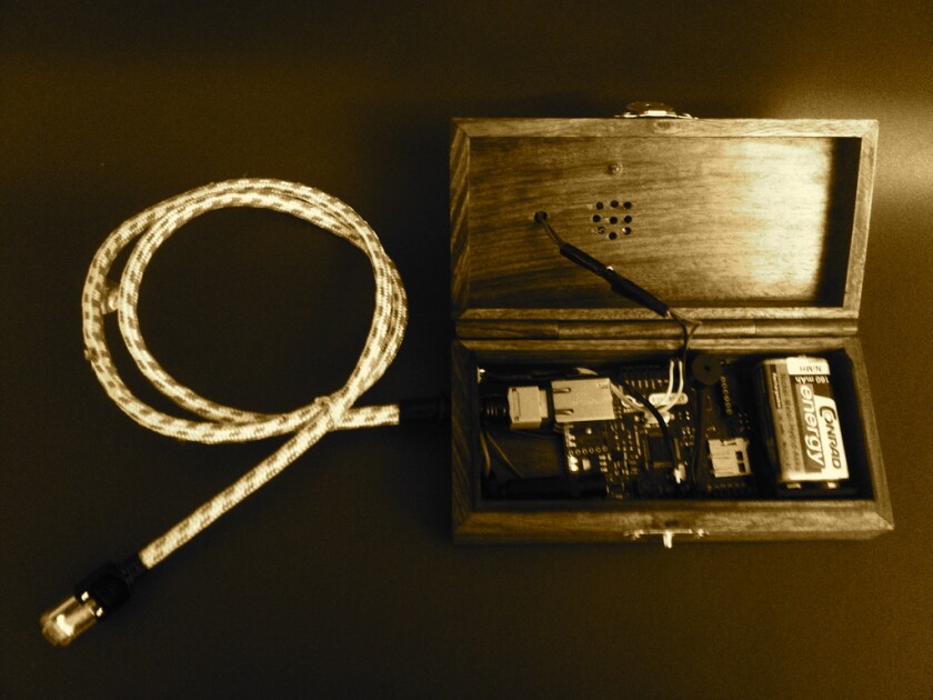 An Arduino Ethernet board takes care of decoding the dot and dash input from the vintage-looking Morse switch on top of the wooden box