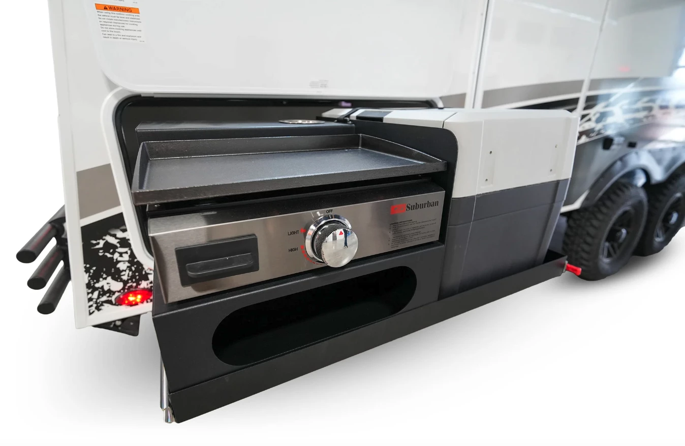 The available slide-out kitchen can be equipped with a griddle and fridge