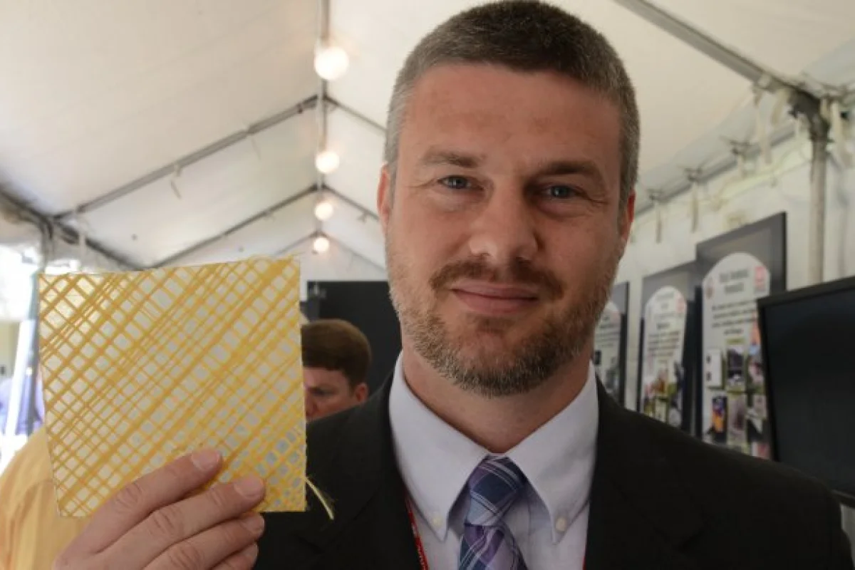 Nick Boone with a sample of the ballistic wallpaper